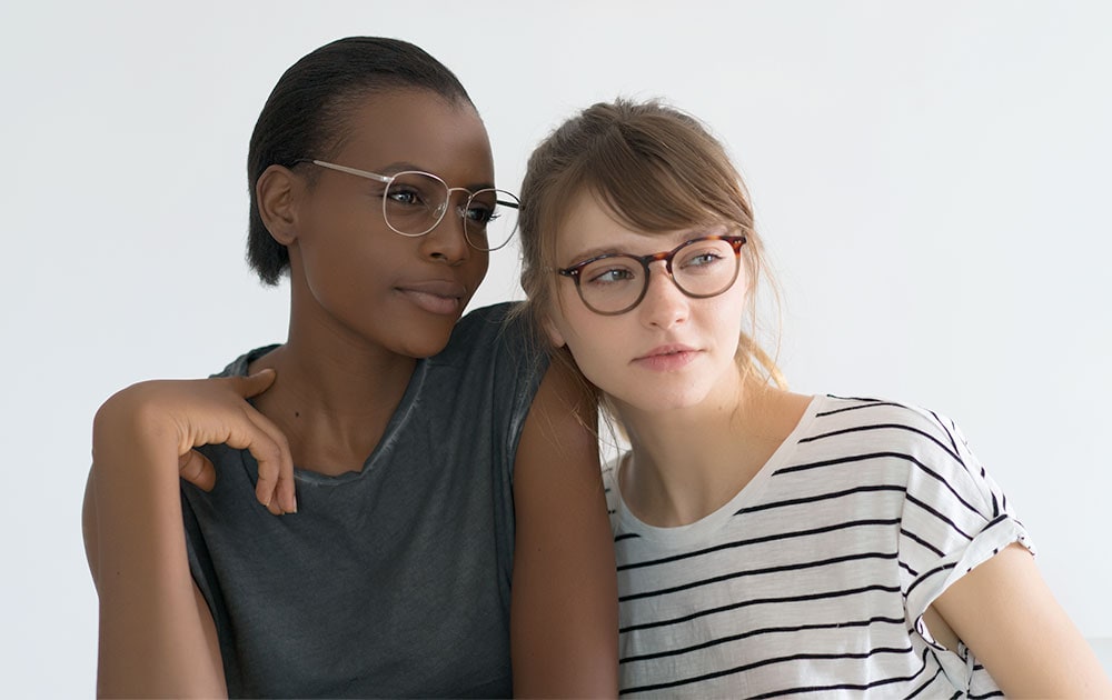 2 girls with metal and acetate eyeglasses