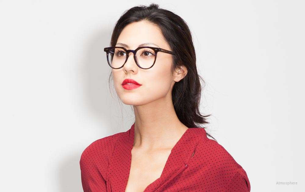 black horn rimmed glasses - woman - red shirt