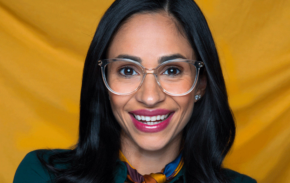 A gif showing a woman wearing eyeglasses with clear frames