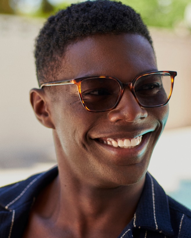 A man wearing inexpensive tortoise sunglasses