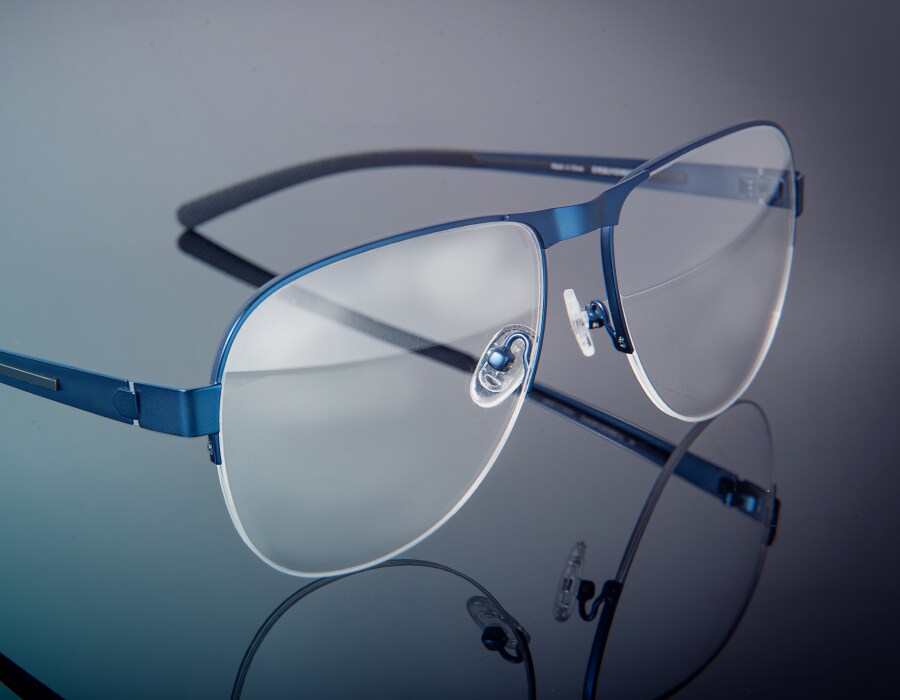 A pair of gaming glasses on a gray backdrop