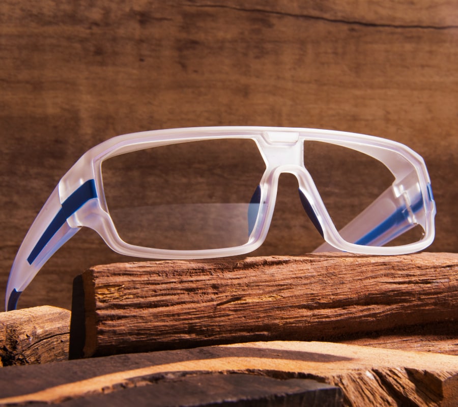 A pair of clear-frame safety glasses