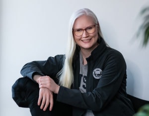 Colleen Young sitting on a sofa