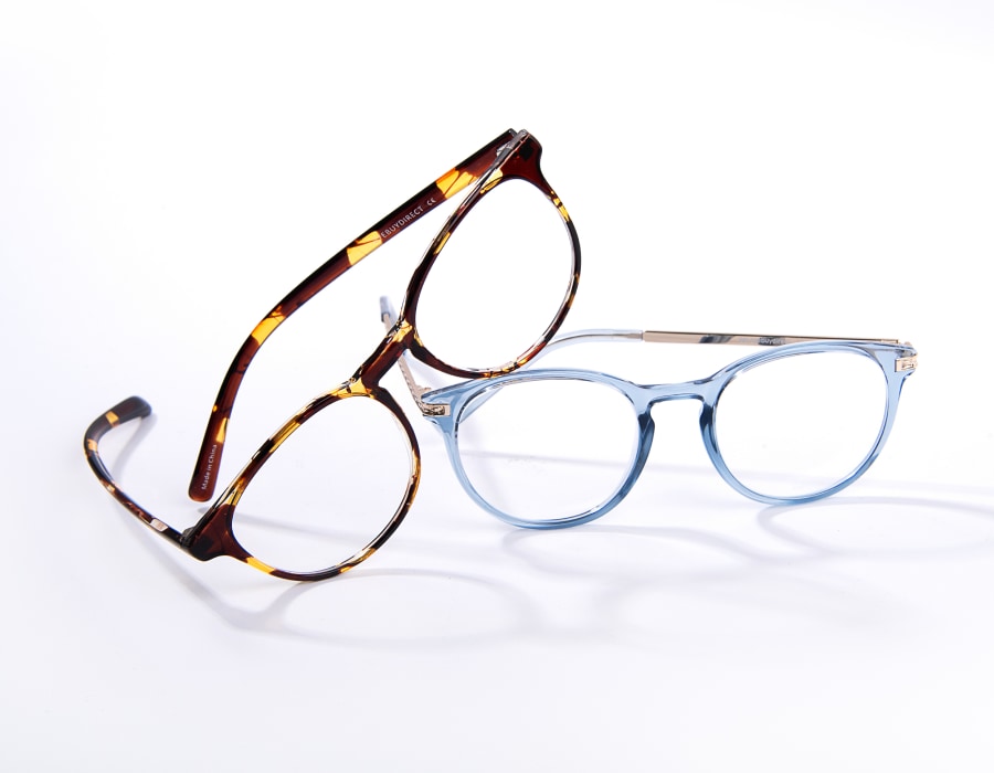 A pair of tortoiseshell and transparent glasses frames