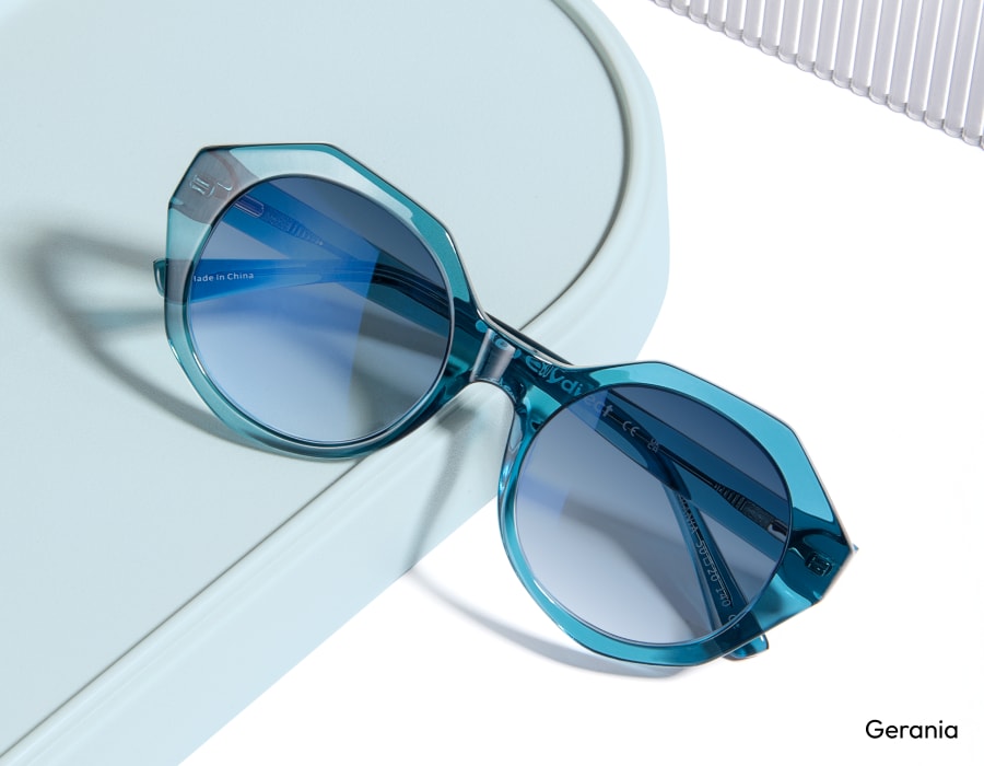 A pair of light blue sunglasses with light blue gradient lenses