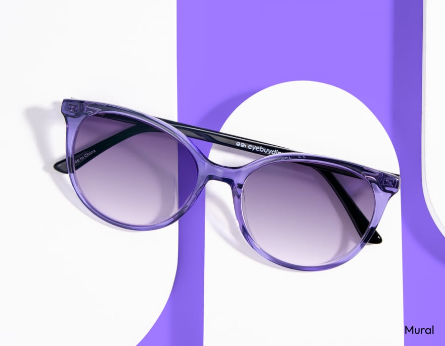 A pair of purple sunglasses with purple gradient lenses