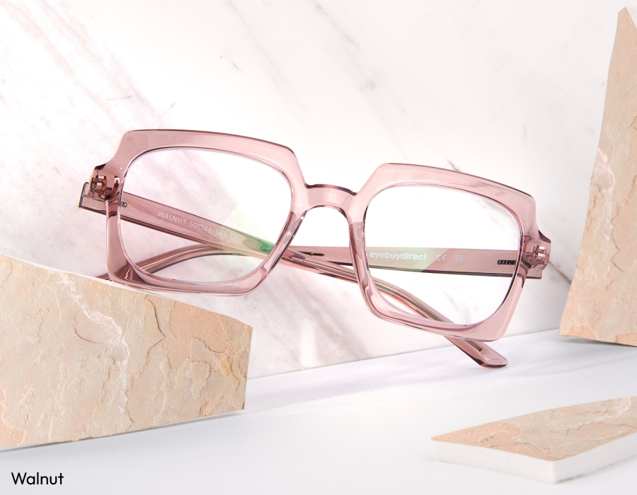A pair of square eyeglasses with pink translucent frames