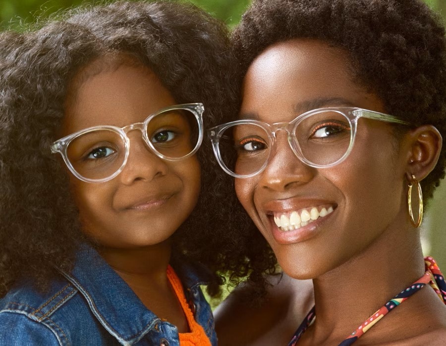 A mother and daughter wearing clear-frame eyeglasses
