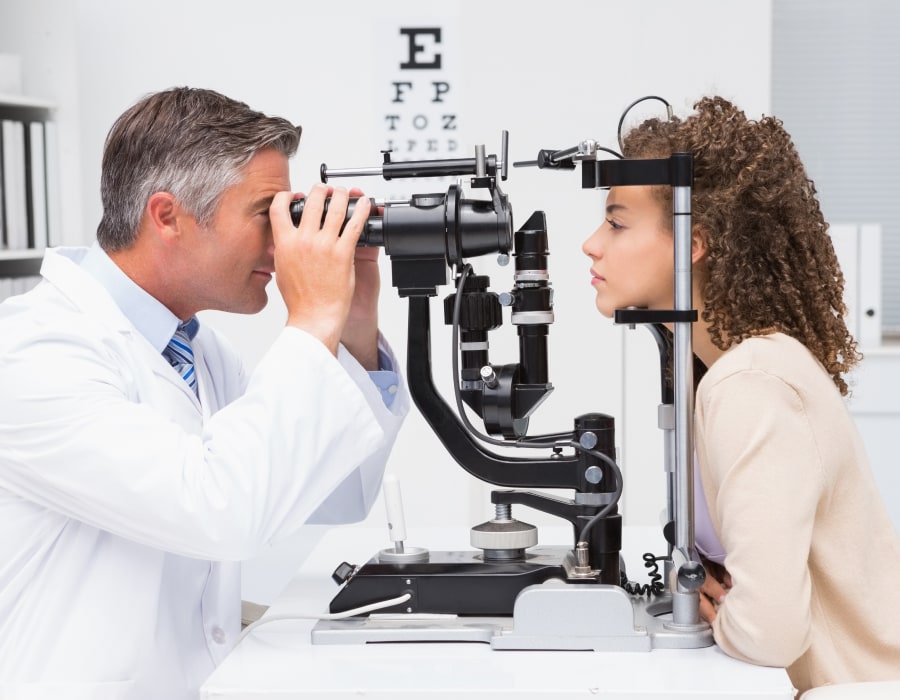 An eyecare professional giving an eye exam