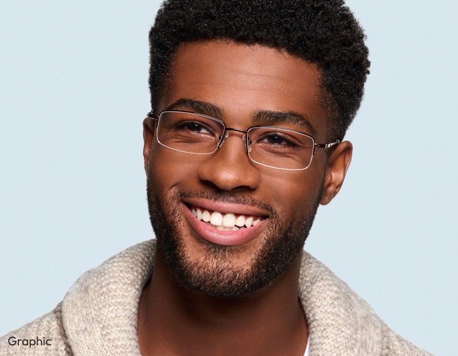 A man smiling wearing rectangular shaped semi-rimless eyeglasses