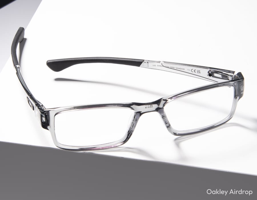 A flatlay of Oakley airdrop eyeglasses in the gray shadow colorway