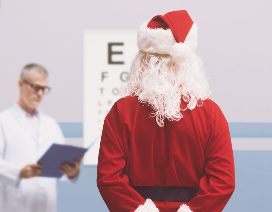 Santa taking an eye test looking at a snellen chart