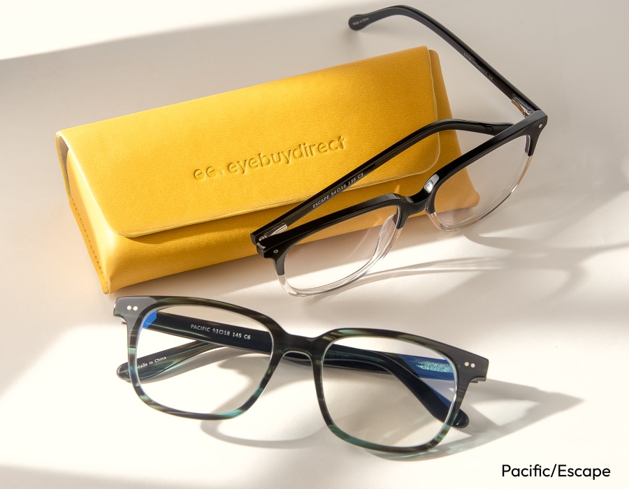 A flatlay of eyeglasses with gray frames and a yellow glasses case