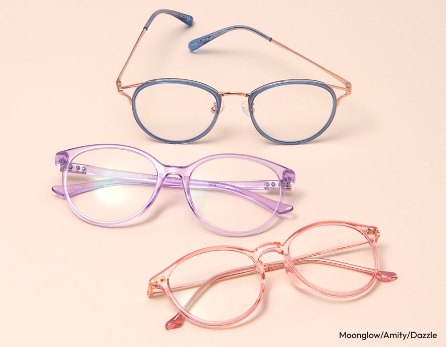 A set of 3 pastel-colored eyeglasses frames on a pink background