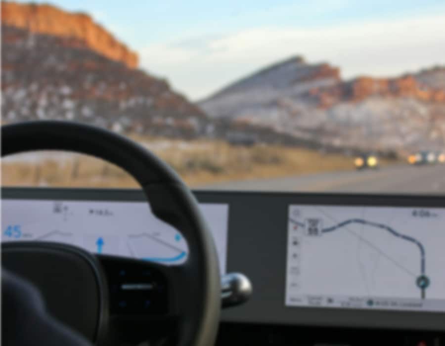 A view from a car driver's seat with blurry vision