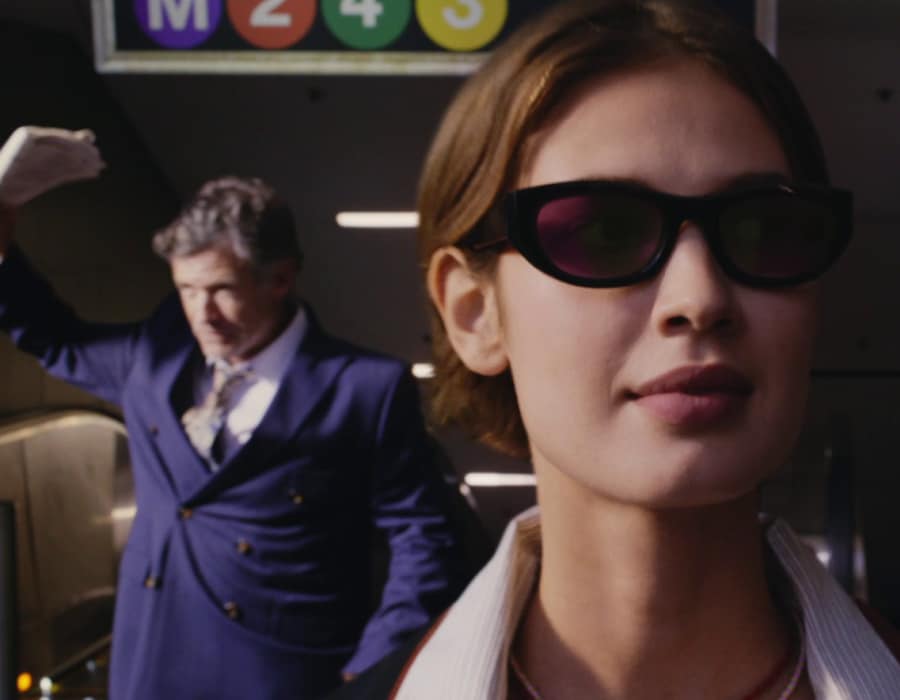 A woman in business clothes wearing Transitions sunglasses