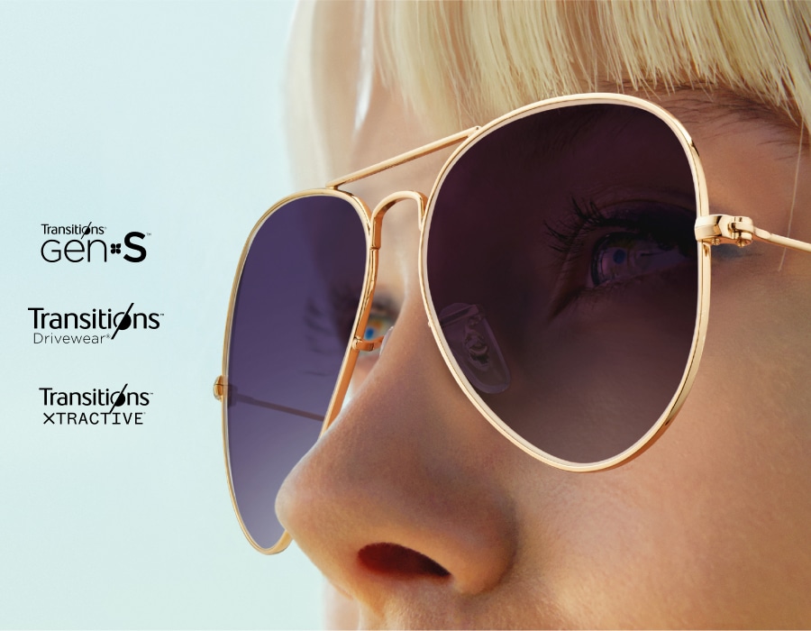 A closeup of a woman wearing transitions sunglasses