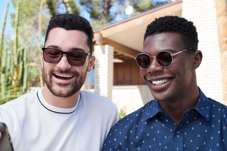 Two men wearing glasses for bigger noses