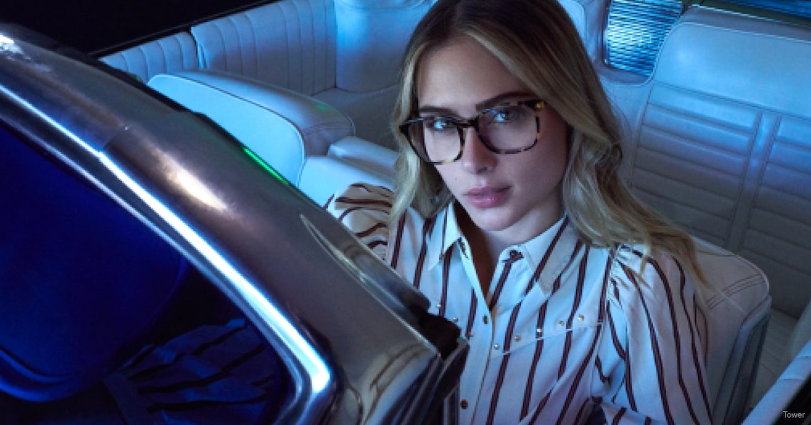 A woman wearing night driving glasses