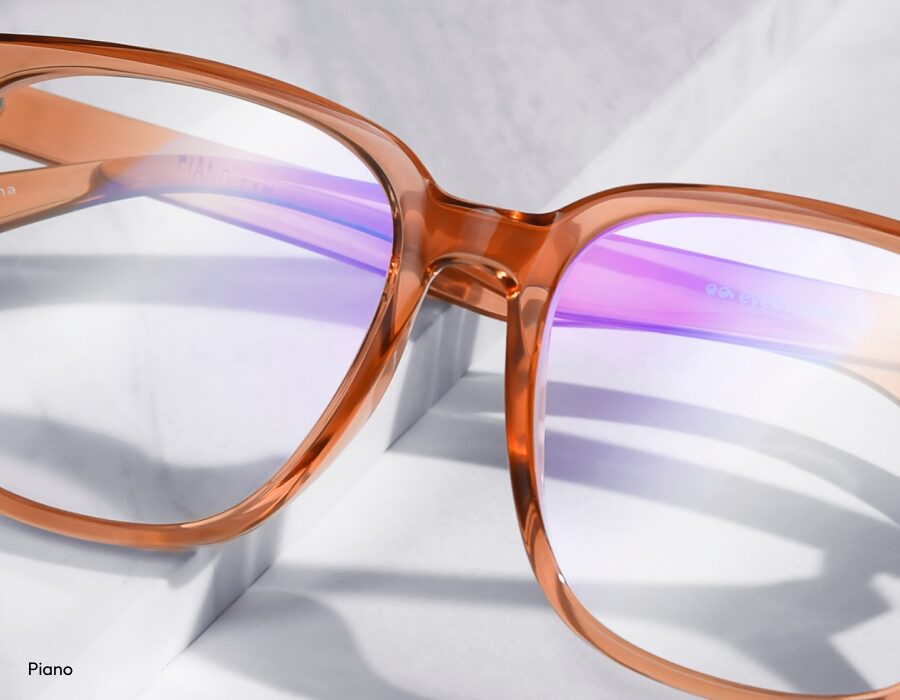 A closeup of a pair of eyeglasses with a saddle nose bridge