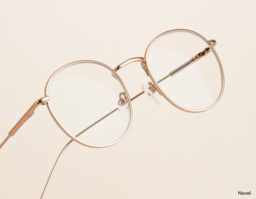 A pair of eyeglasses with thin gold frames