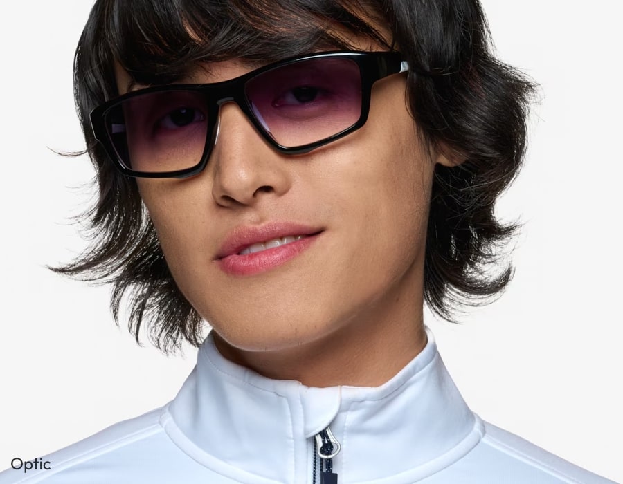 A person wearing gradient sunglasses