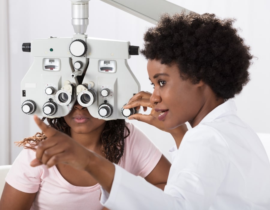 A woman receiving an eye exam