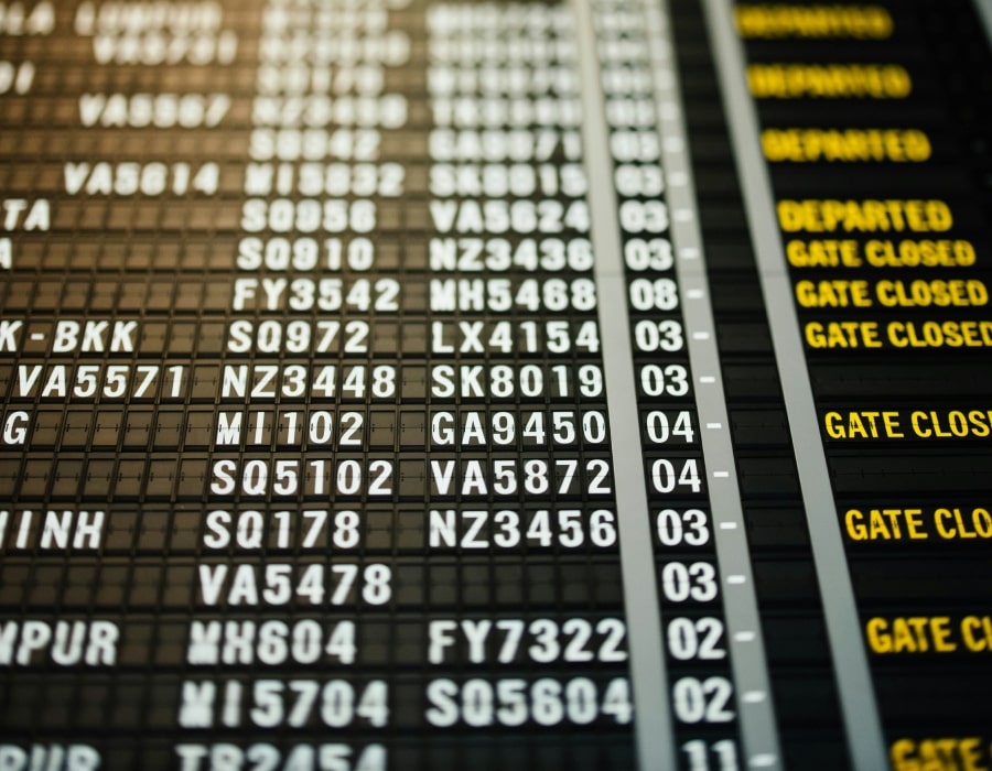 An image of an airport flight information board