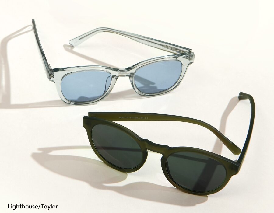 A pair of sunglasses with transparent frames and light blue lenses, and a pair of sunglasses with dark green frames and dark lenses