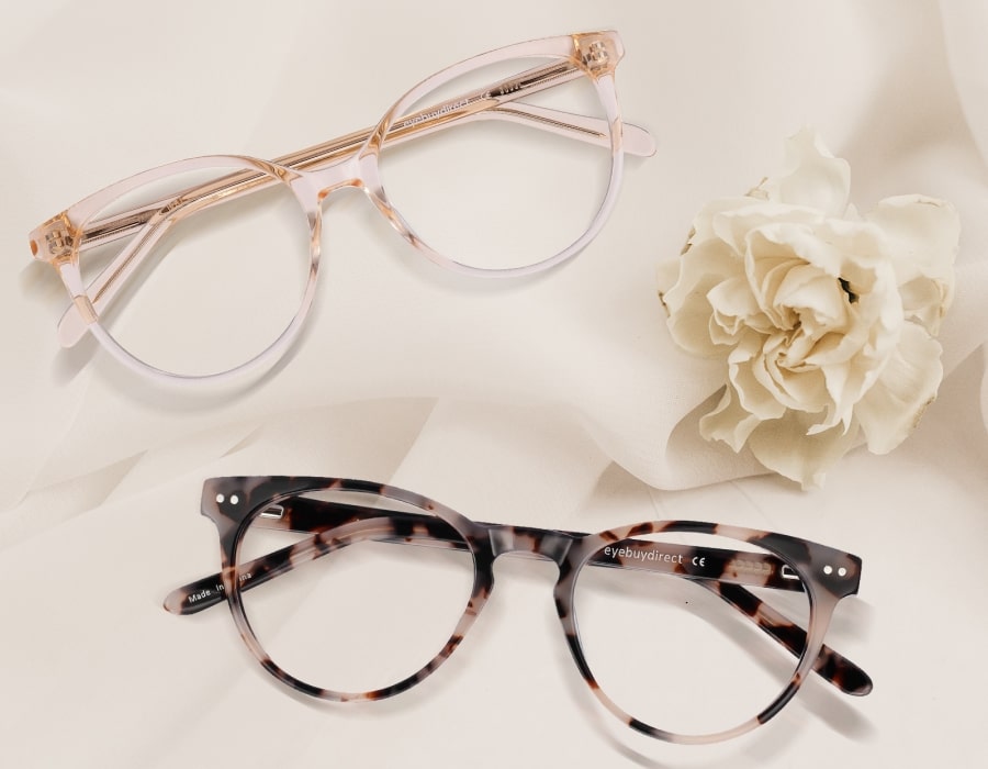 A pair of light colored wedding glasses