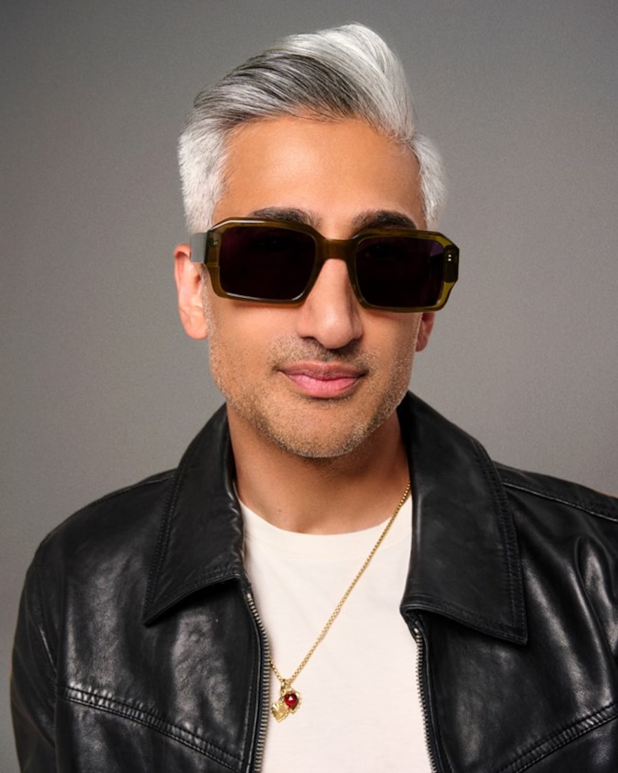 Tan France wearing a black jacket and large square-shaped sunglasses