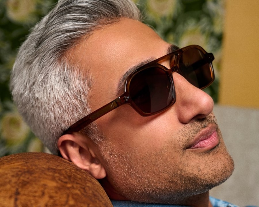 A closeup of Tan France wearing sunglasses