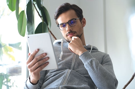 Man with SightRelax glasses on iPad